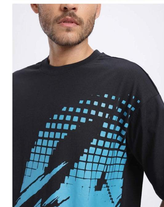 Black t-shirt with blue geometric pattern worn by a person on a white background