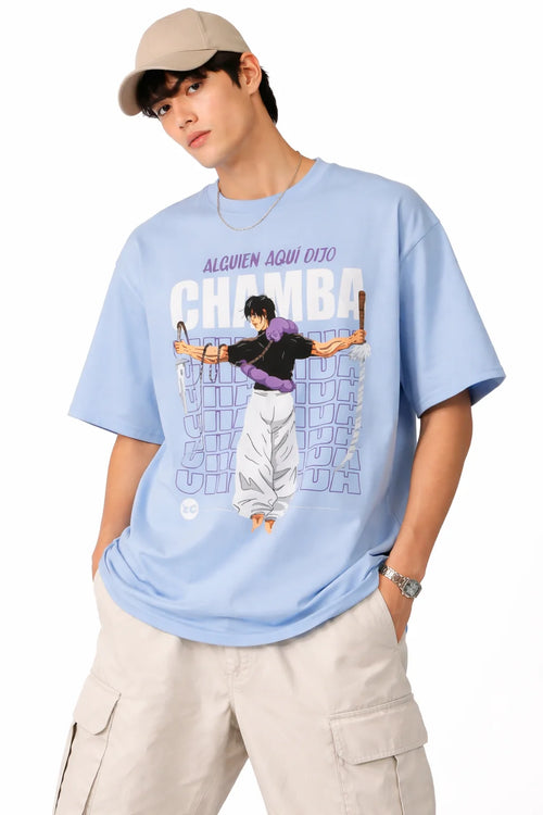 Person wearing a light blue t-shirt with a graphic design and text, standing against a white background.