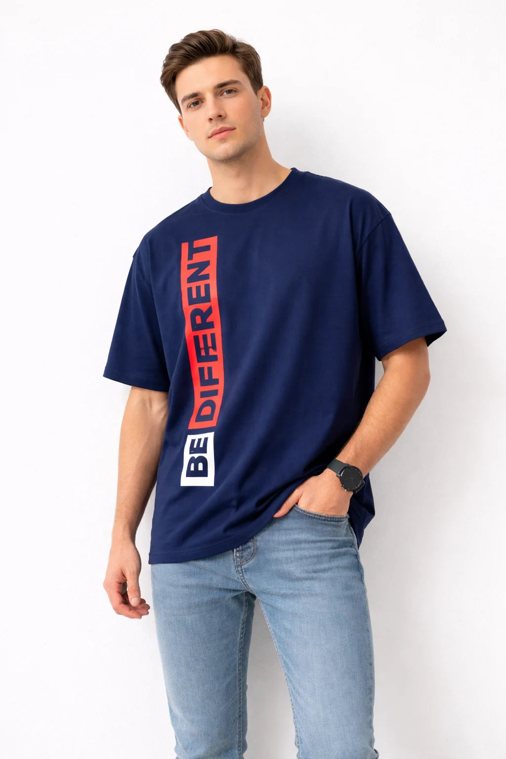 Man wearing a navy blue t-shirt with 'BE DIFFERENT' text on a white background