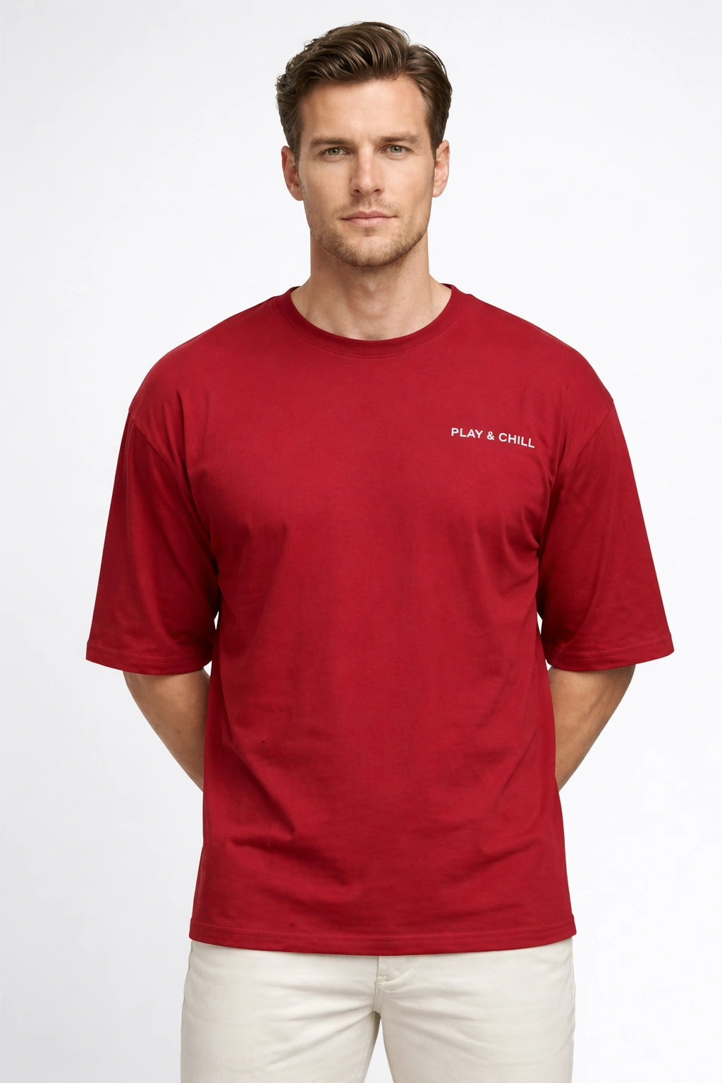 Man wearing a red t-shirt with 'Play & Chill' text on a white background