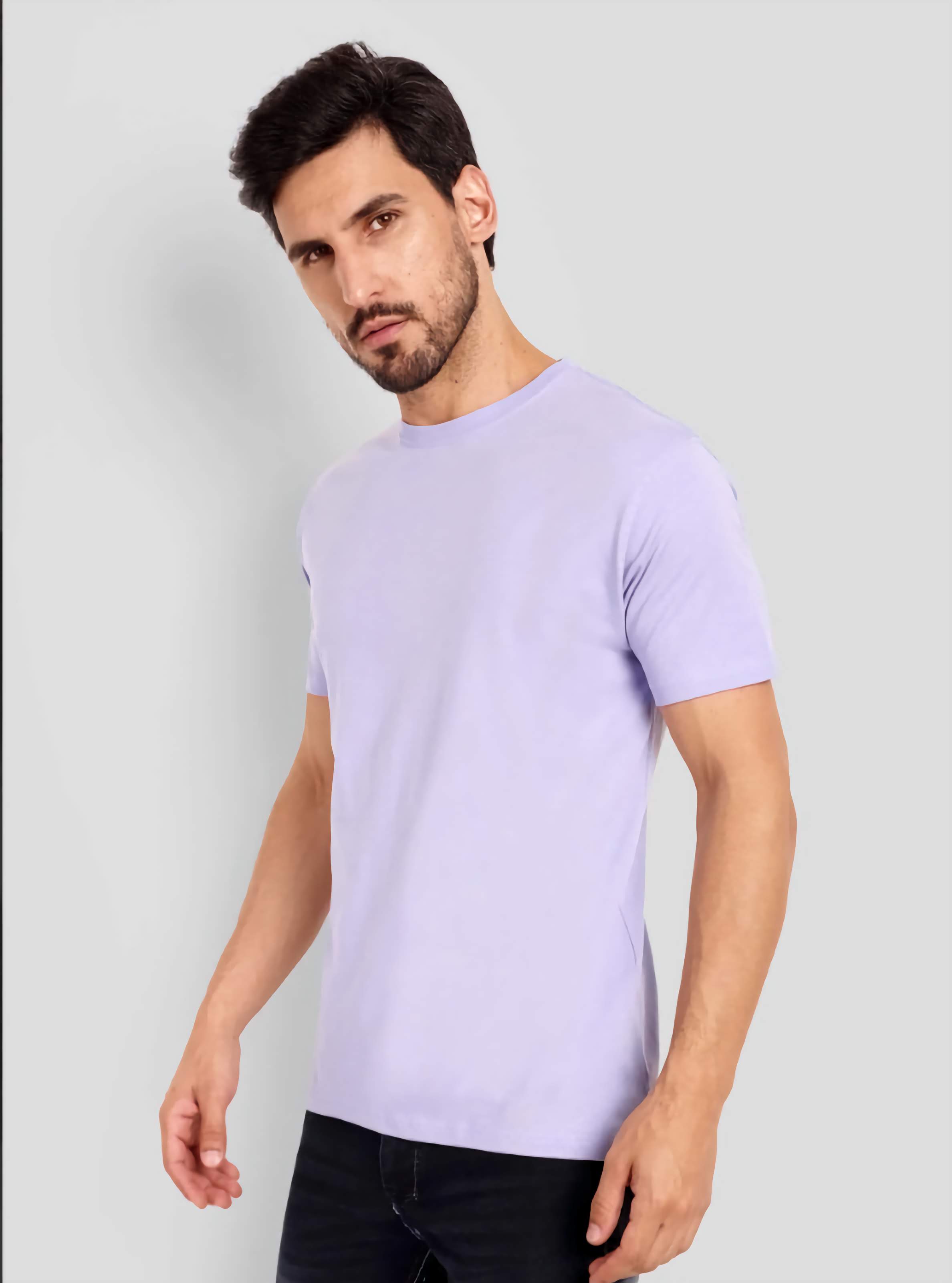 Man wearing a light purple t-shirt against a plain background