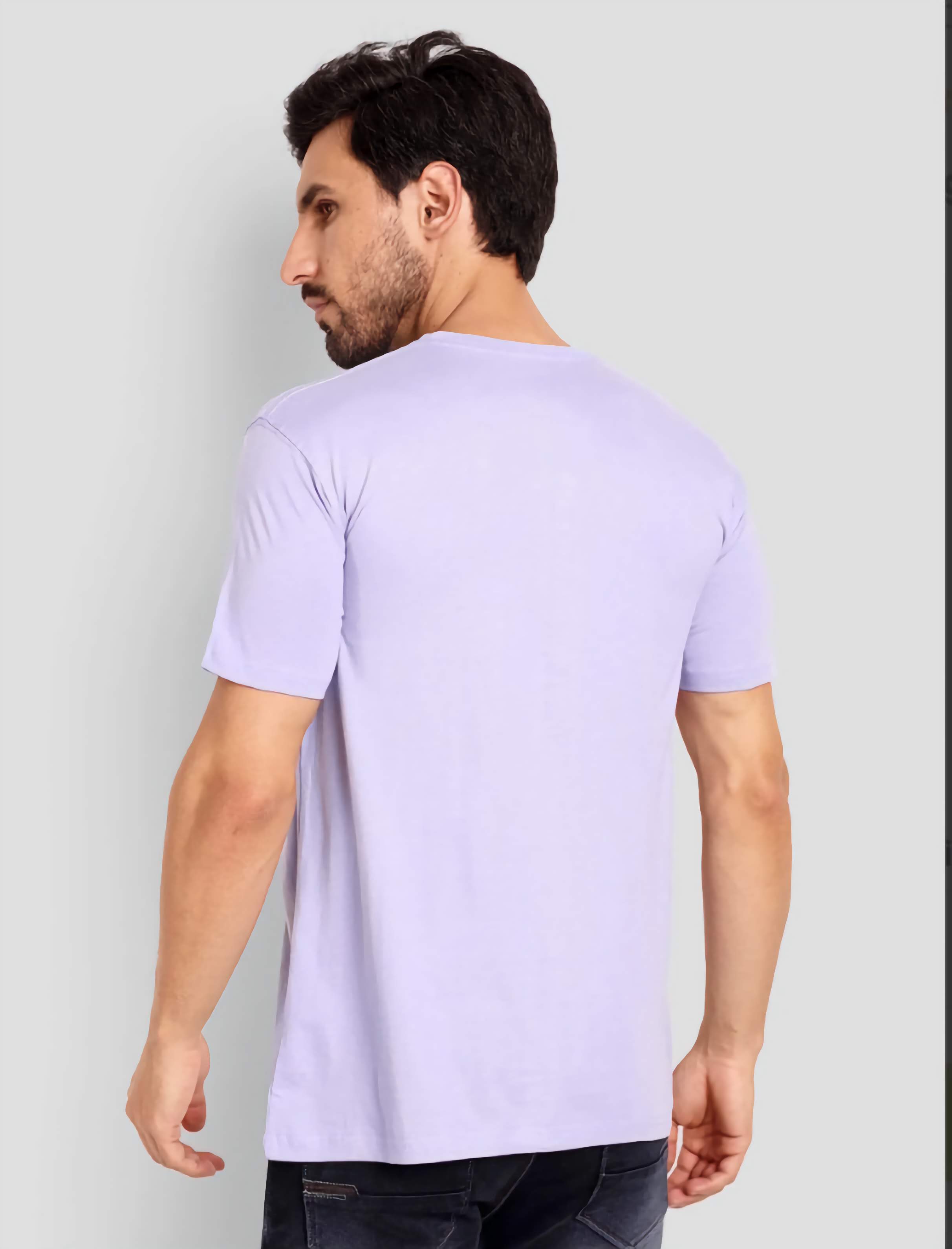 Man wearing a light purple t-shirt against a plain background