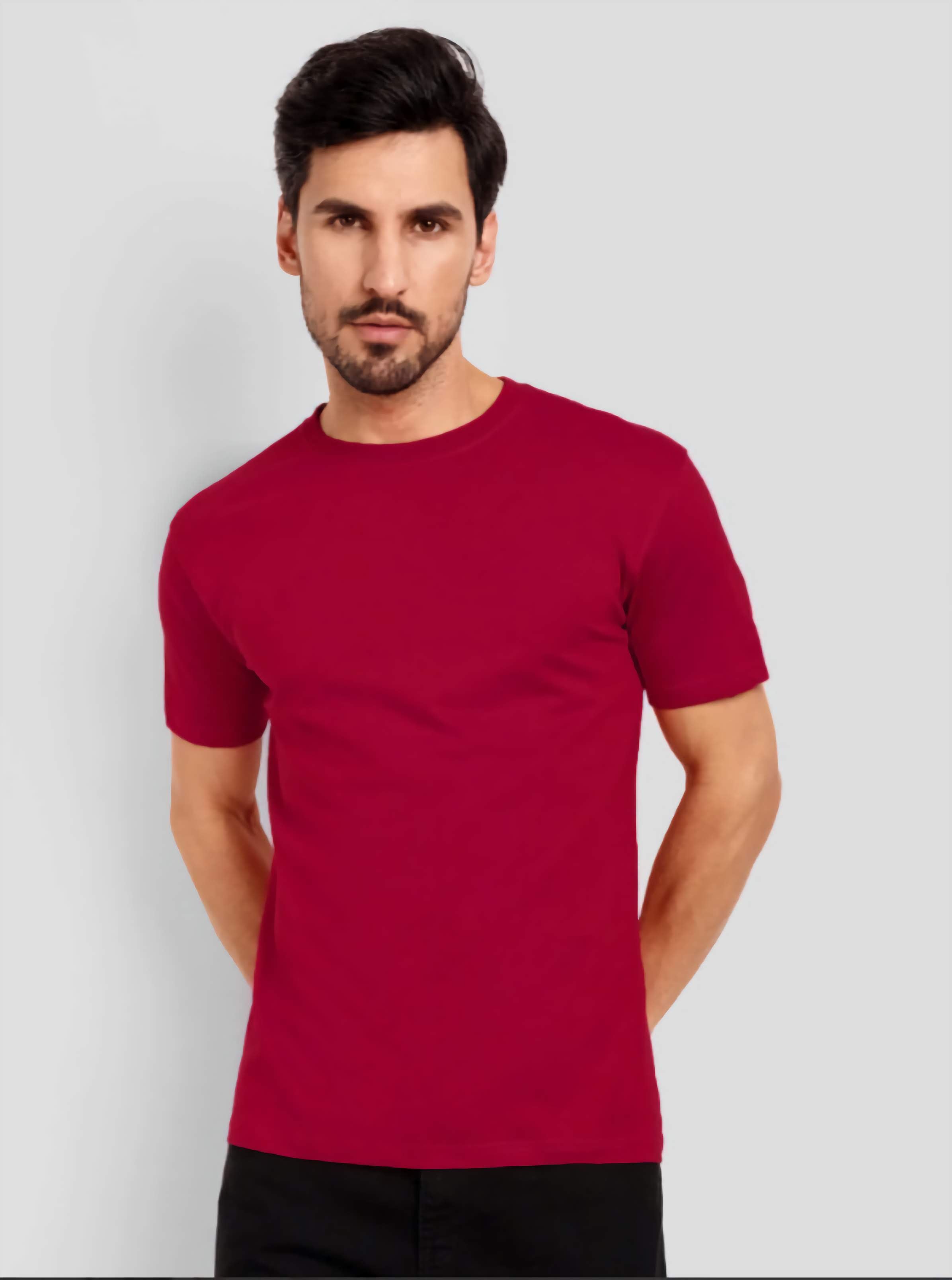 Man wearing a red t-shirt against a light gray background