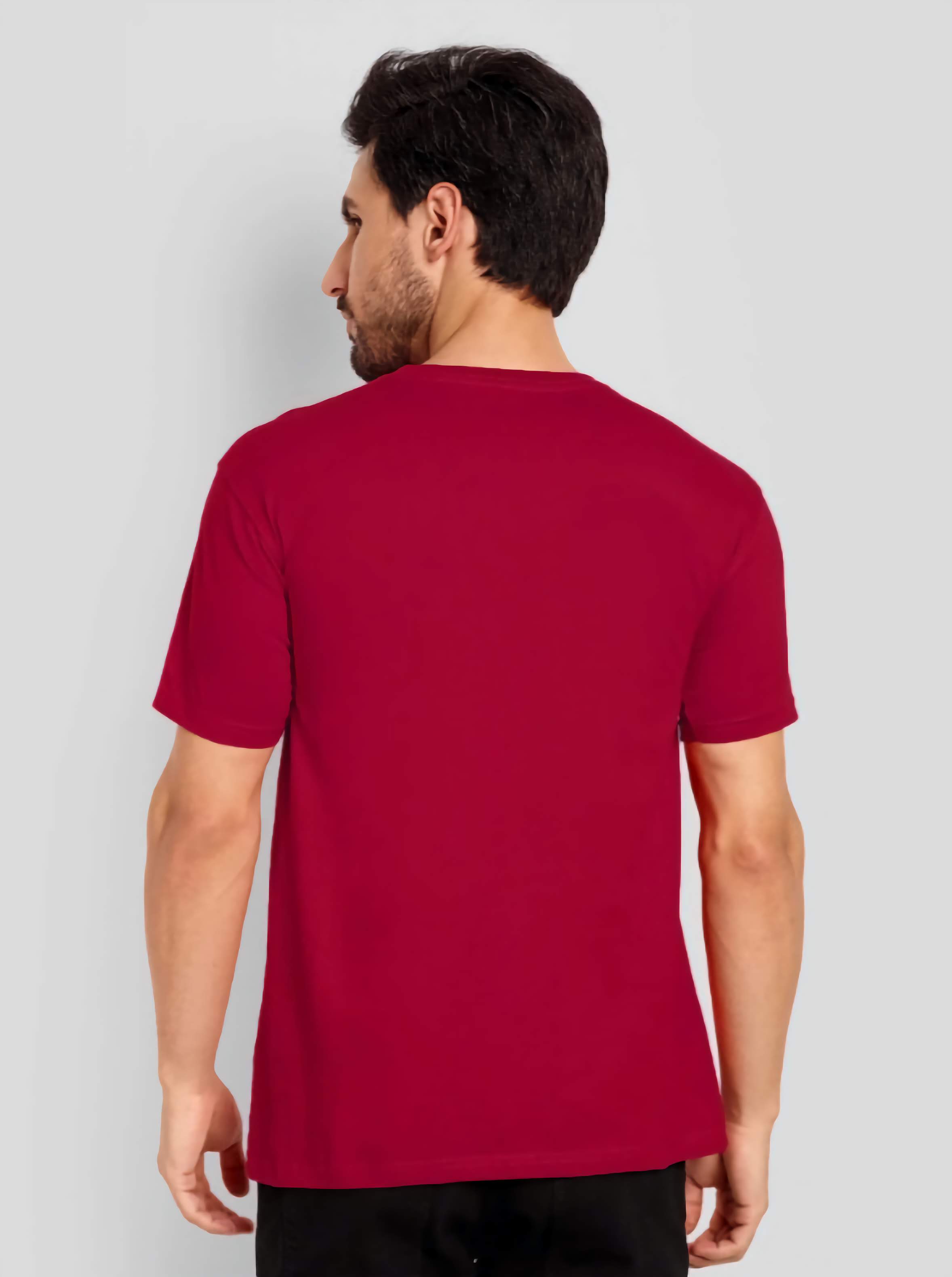 Man wearing a red t-shirt against a light gray background