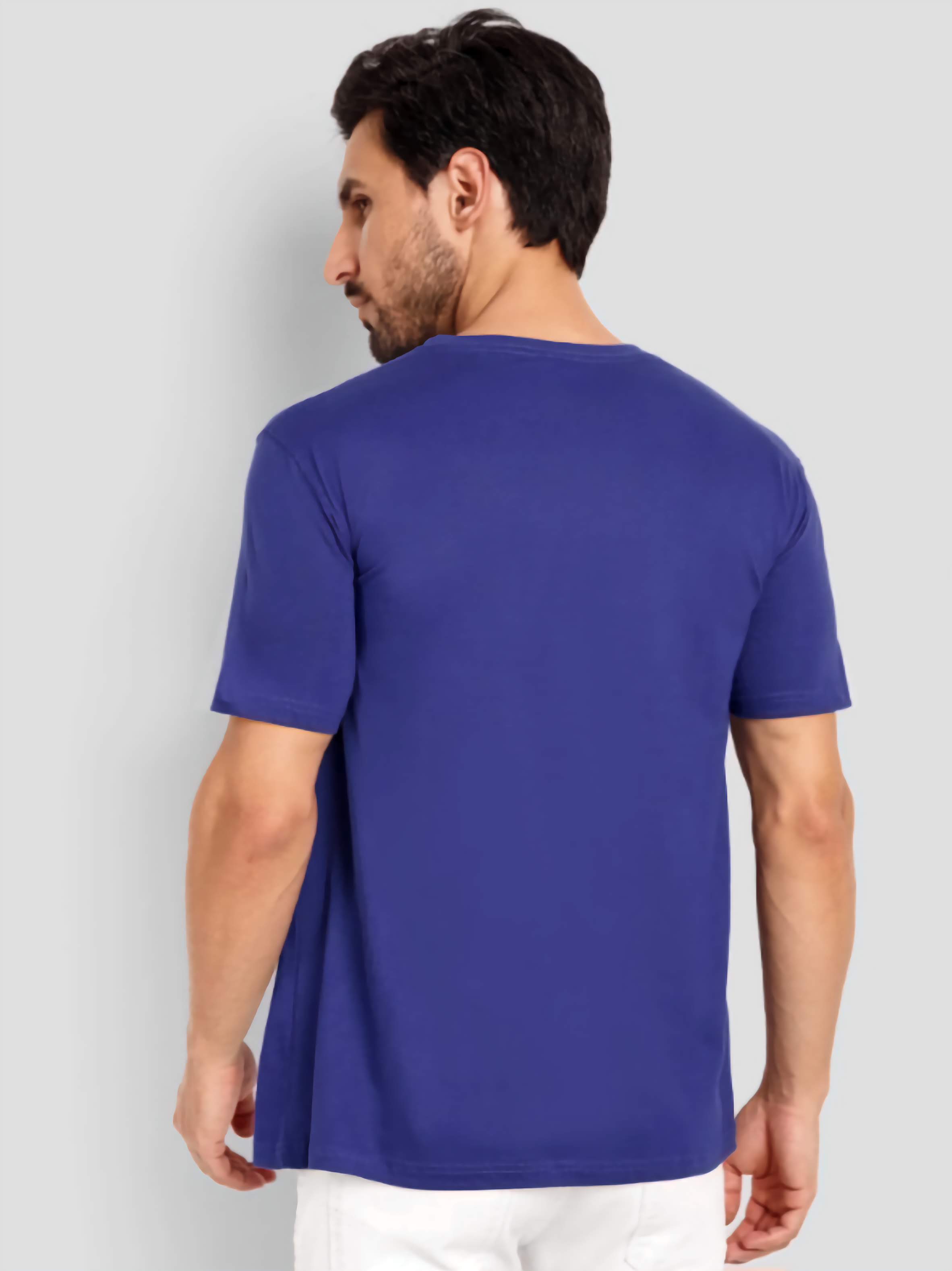 Man wearing a blue t-shirt on a light gray background