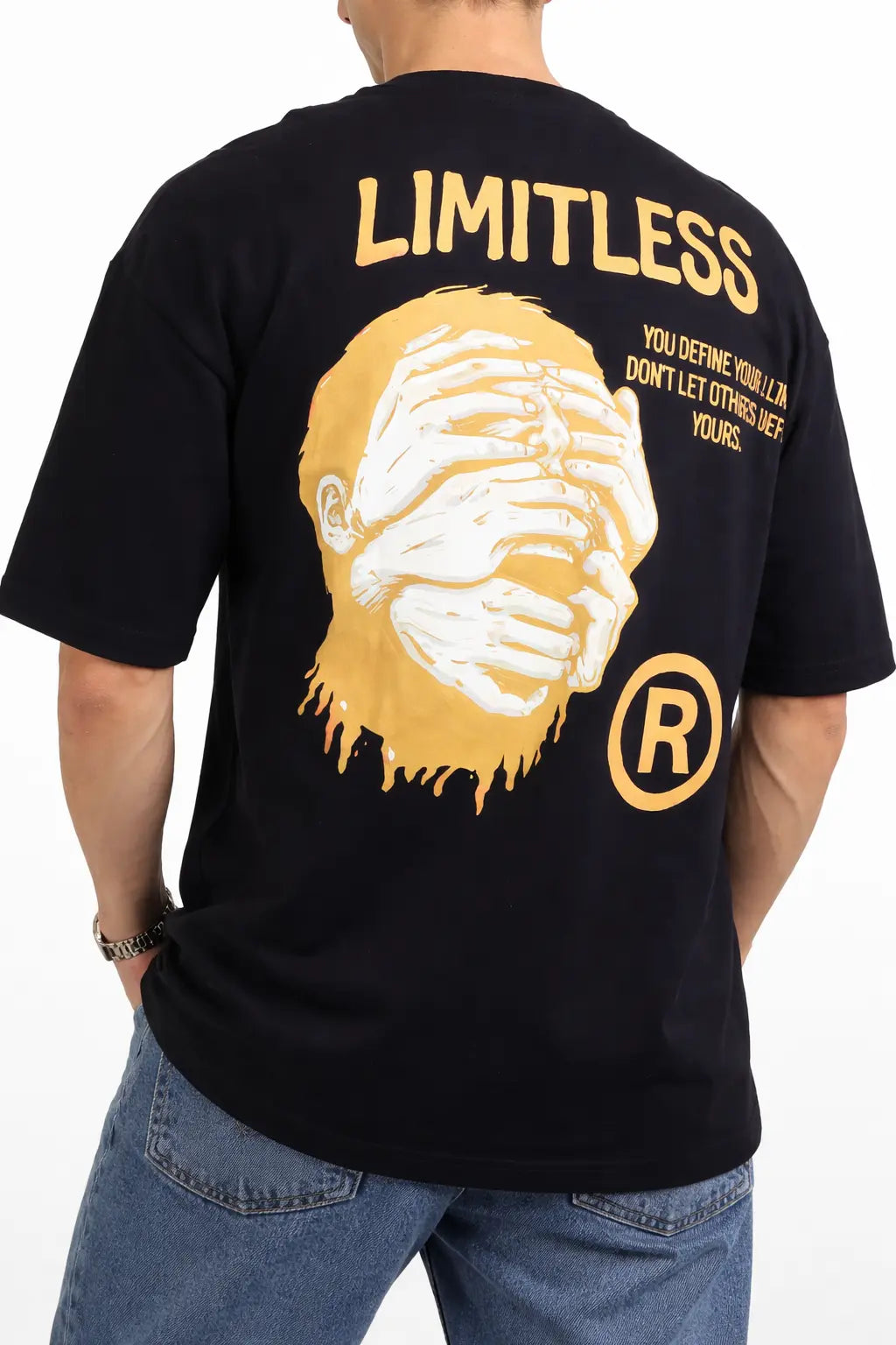 Black t-shirt with yellow graphic and text on the back, worn by a person.