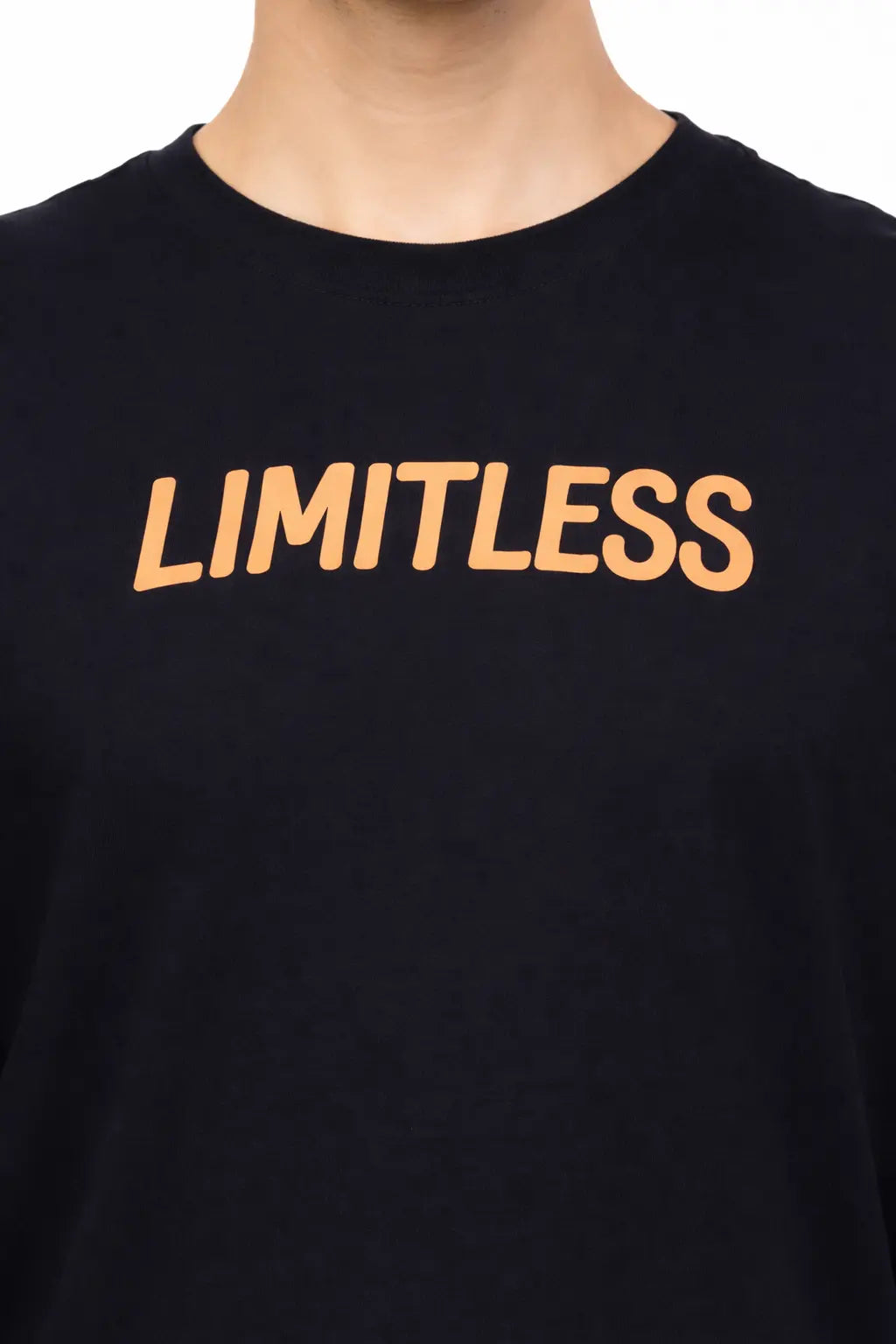 Close up shot of Black tshirt with limitless printed in the front