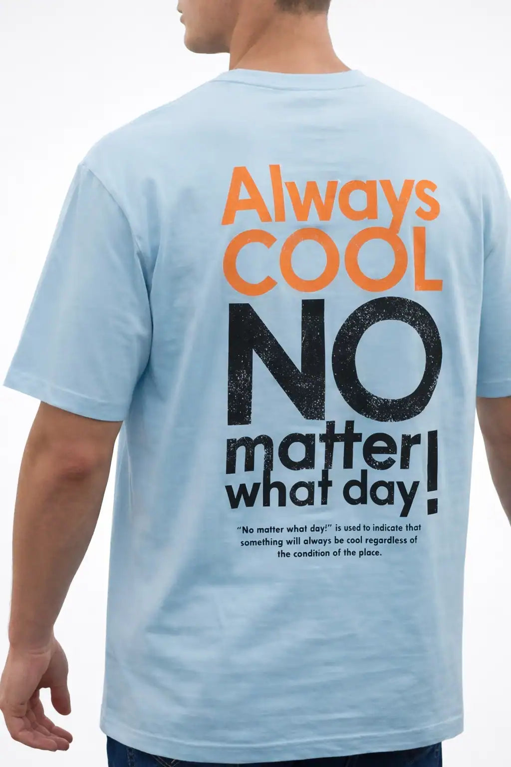 Light blue t-shirt with motivational text on the back, worn by a person.