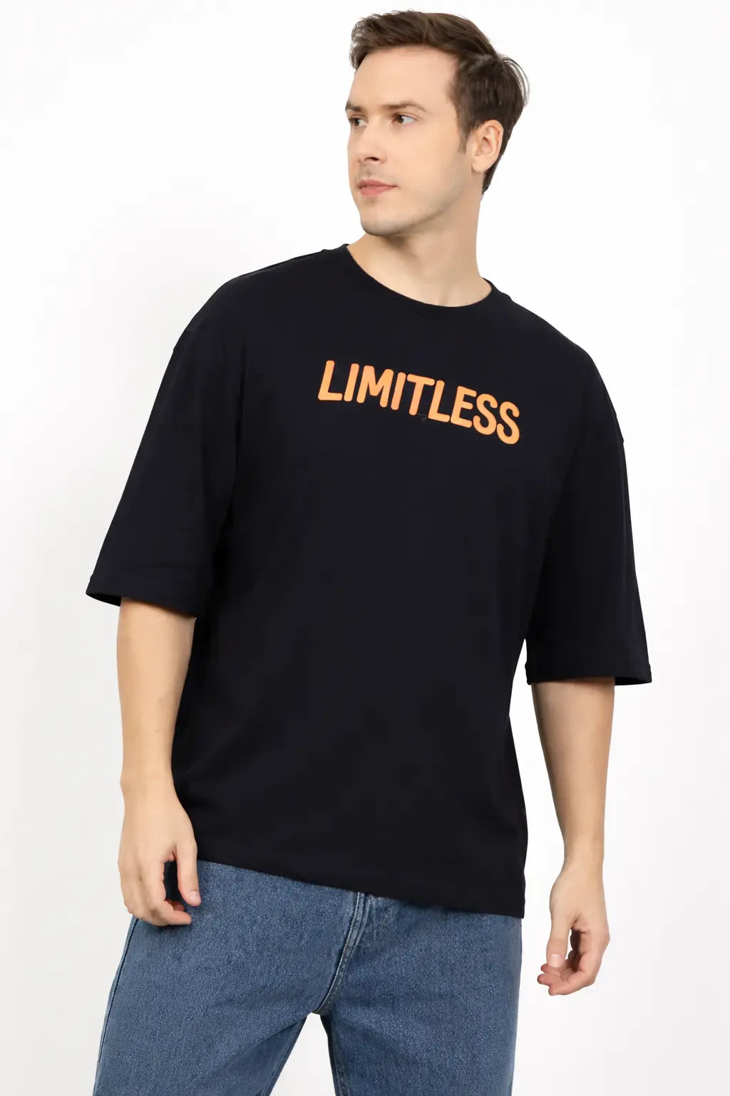 Man wearing a black t-shirt with 'LIMITLESS' text on a white background
